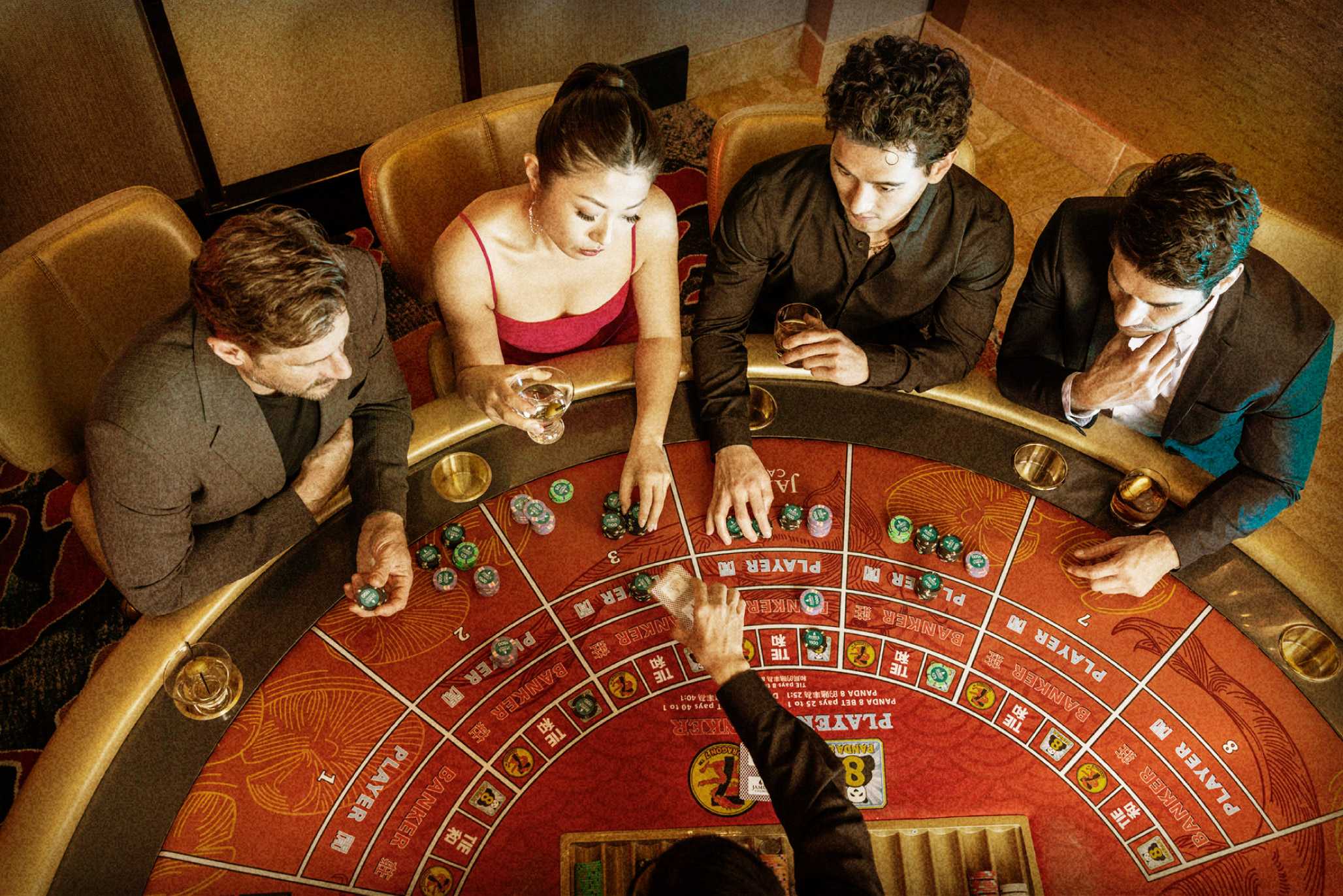 Four people playing table games at Jamul Casino Resort