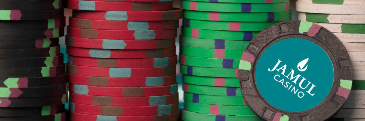 Casino poker chips stacked with Jamul Casino Resort logo chip in the foreground.